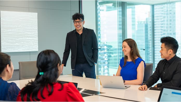 Employees in meeting discussion