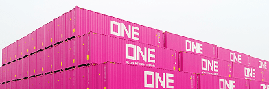 a reach stacker stacking shipping containers as a vast wall at depot