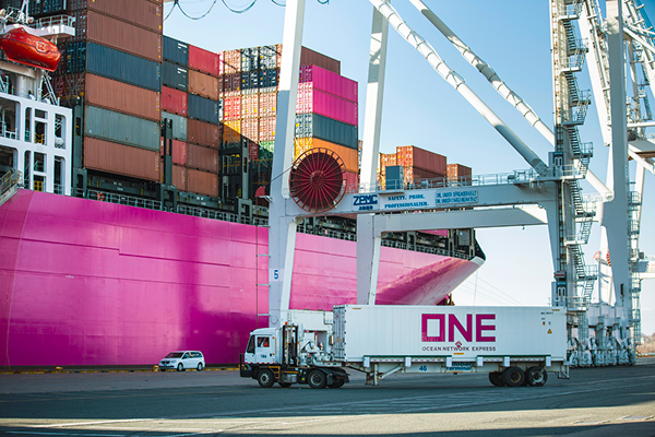 Truck hauling shipping container inland
