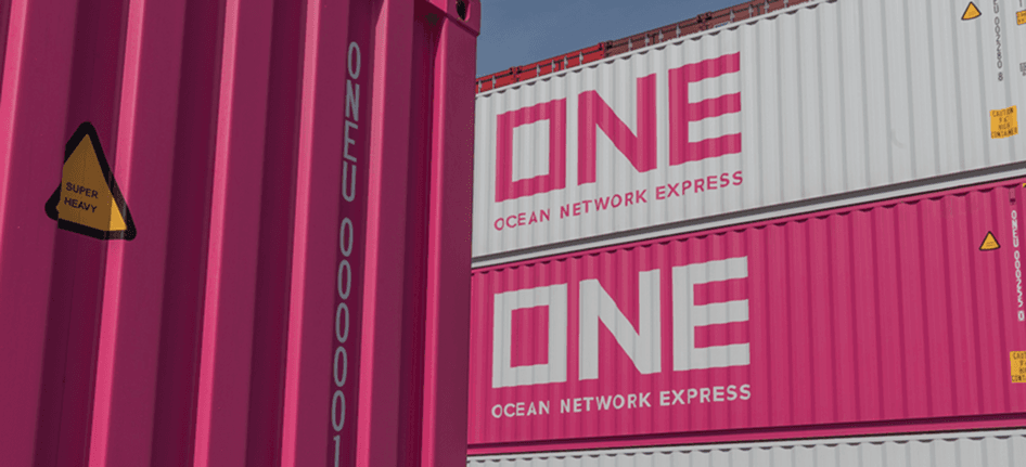Stacked Ocean Network Express shipping containers at a logistics terminal