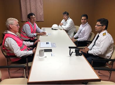 Ship management meeting with vessel crew
